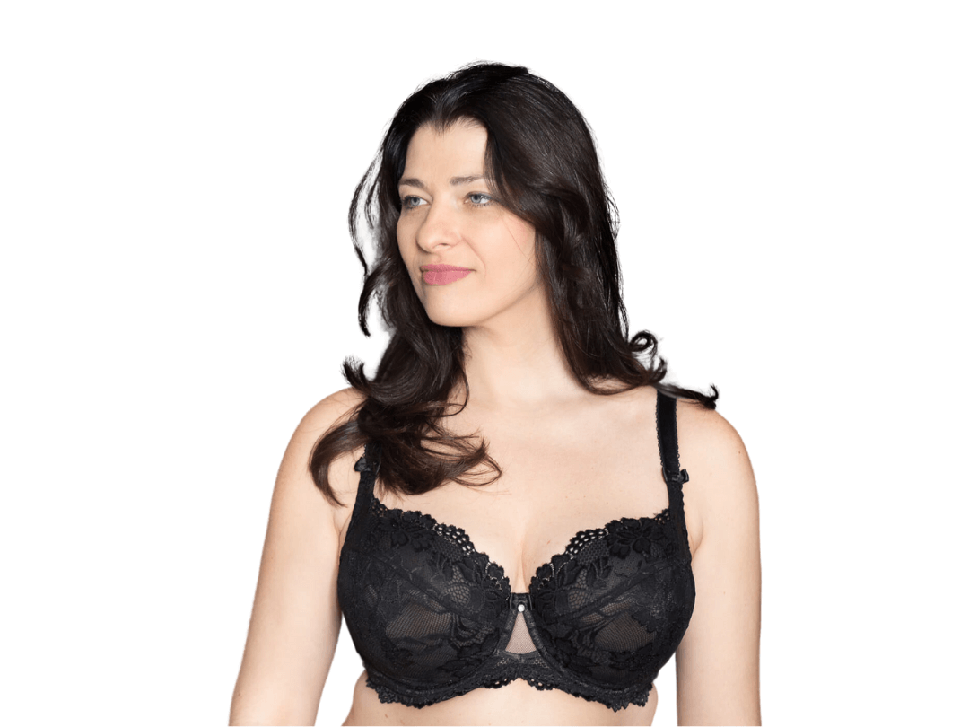Front side view of model wearing black BM Balconette bra and smiling at camera with arms down to her side